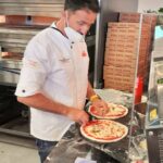 Pizza-Akrobatik zur Musik im Hause PUMA